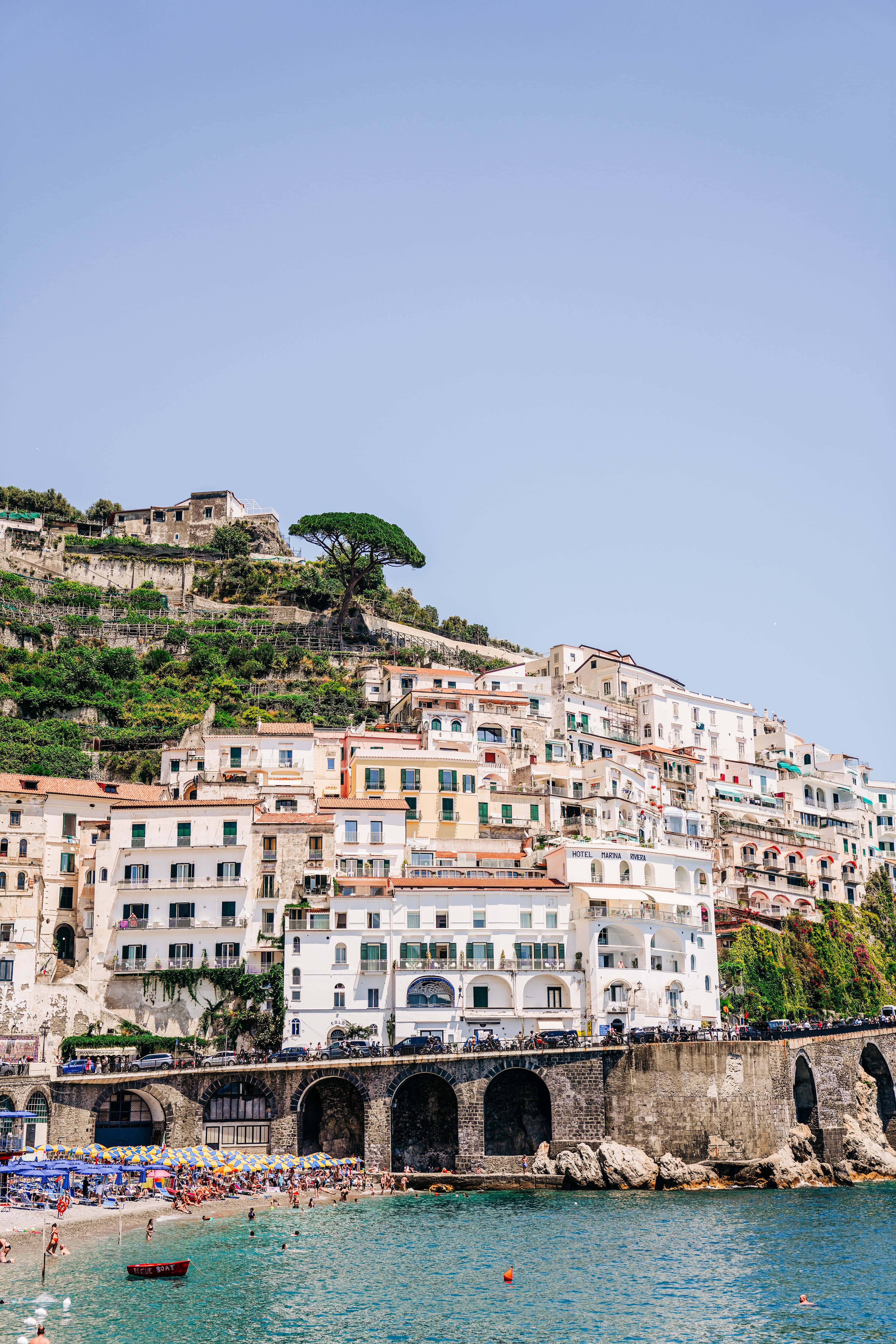 The Amalfi facade with beach goers  sunbathing