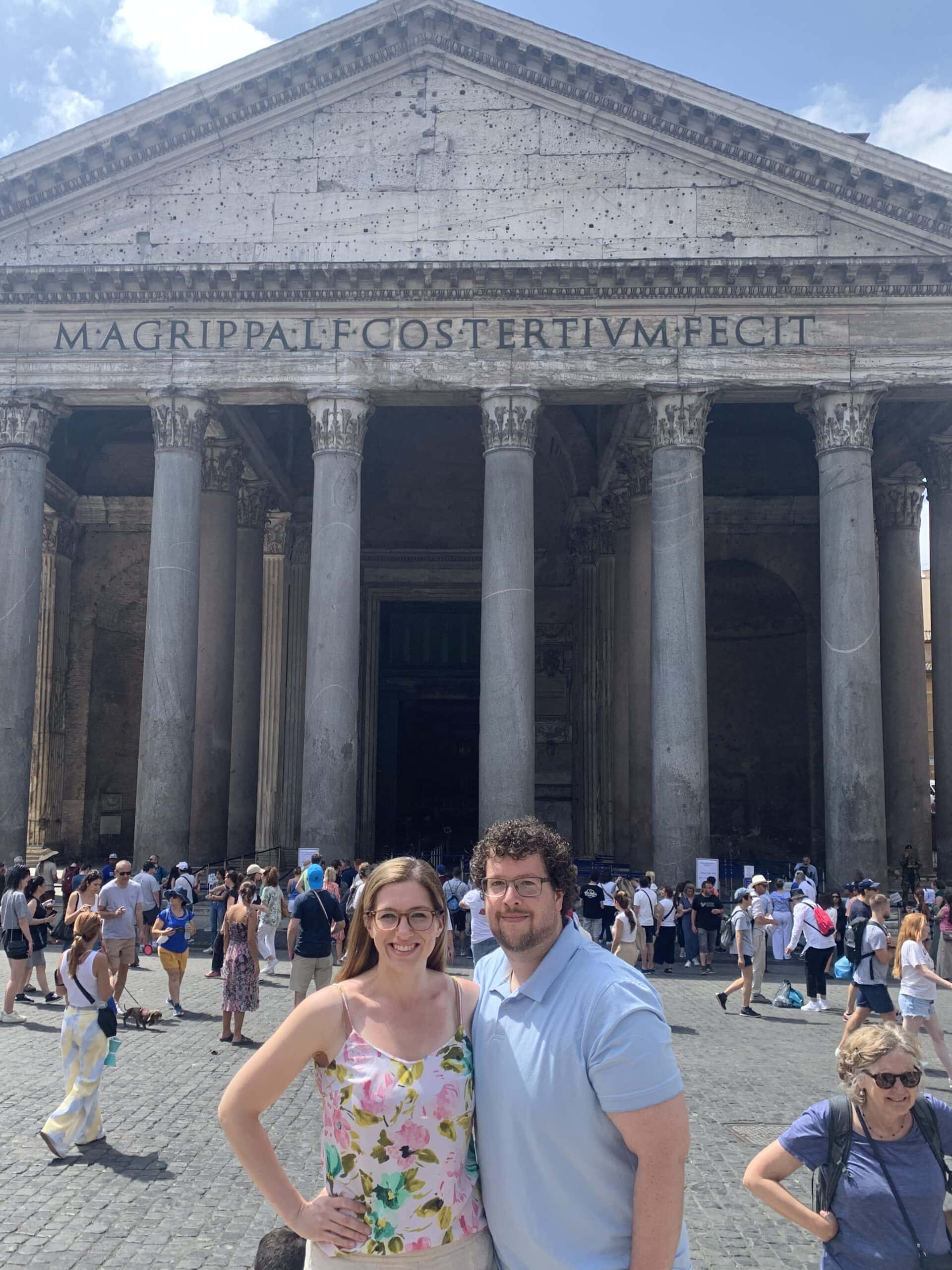 a couple standing in front of the Roman Pantheon