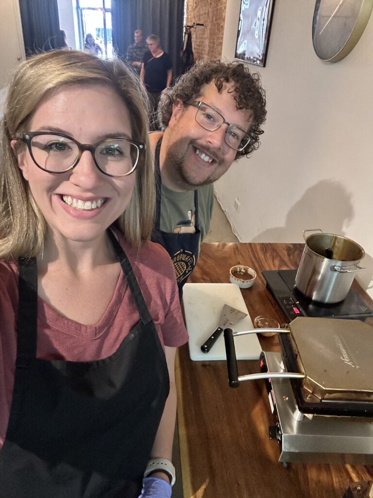 a couple with a pot for cooking