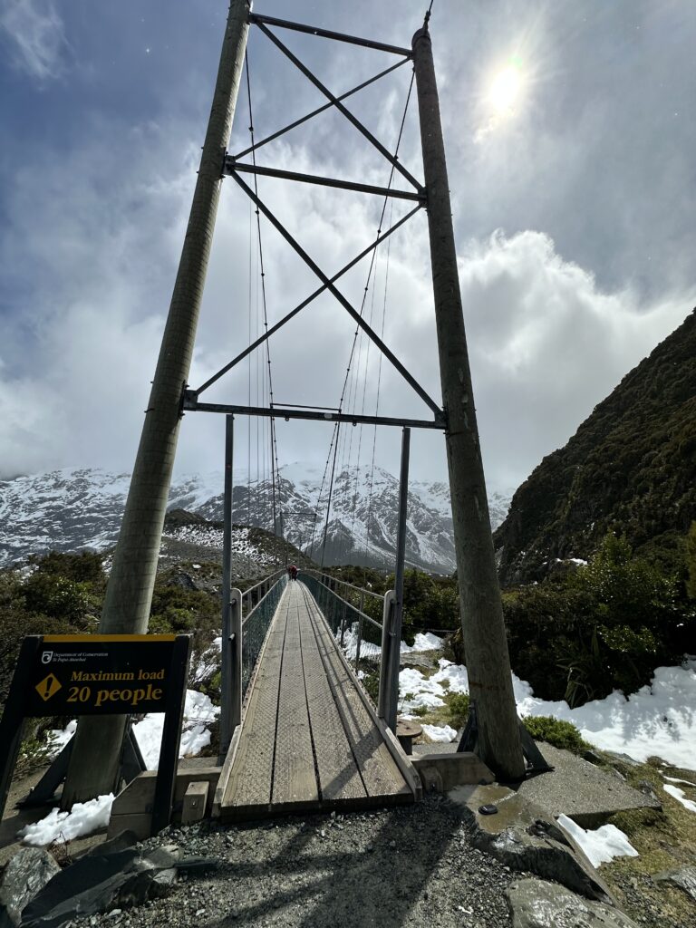 a suspension bridge in the mountains