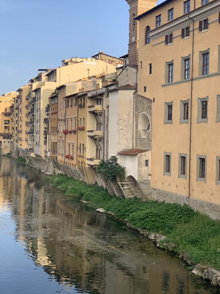 Florence buildings shining in the river