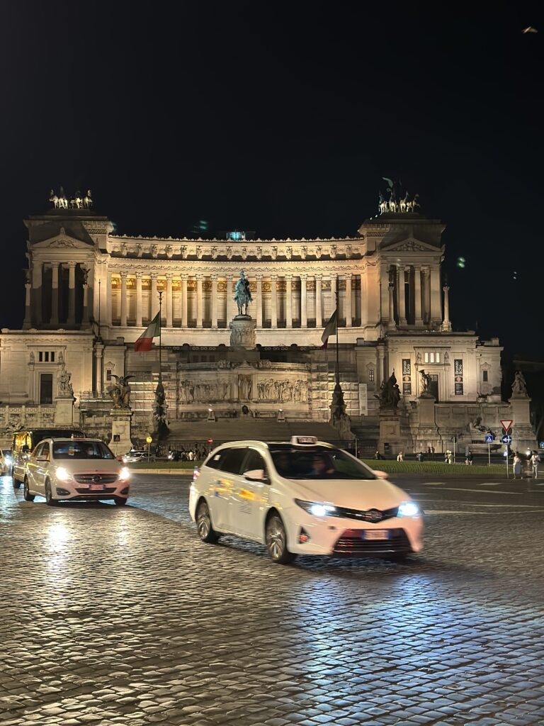 a car driving in front of the capital building in Rome Italy