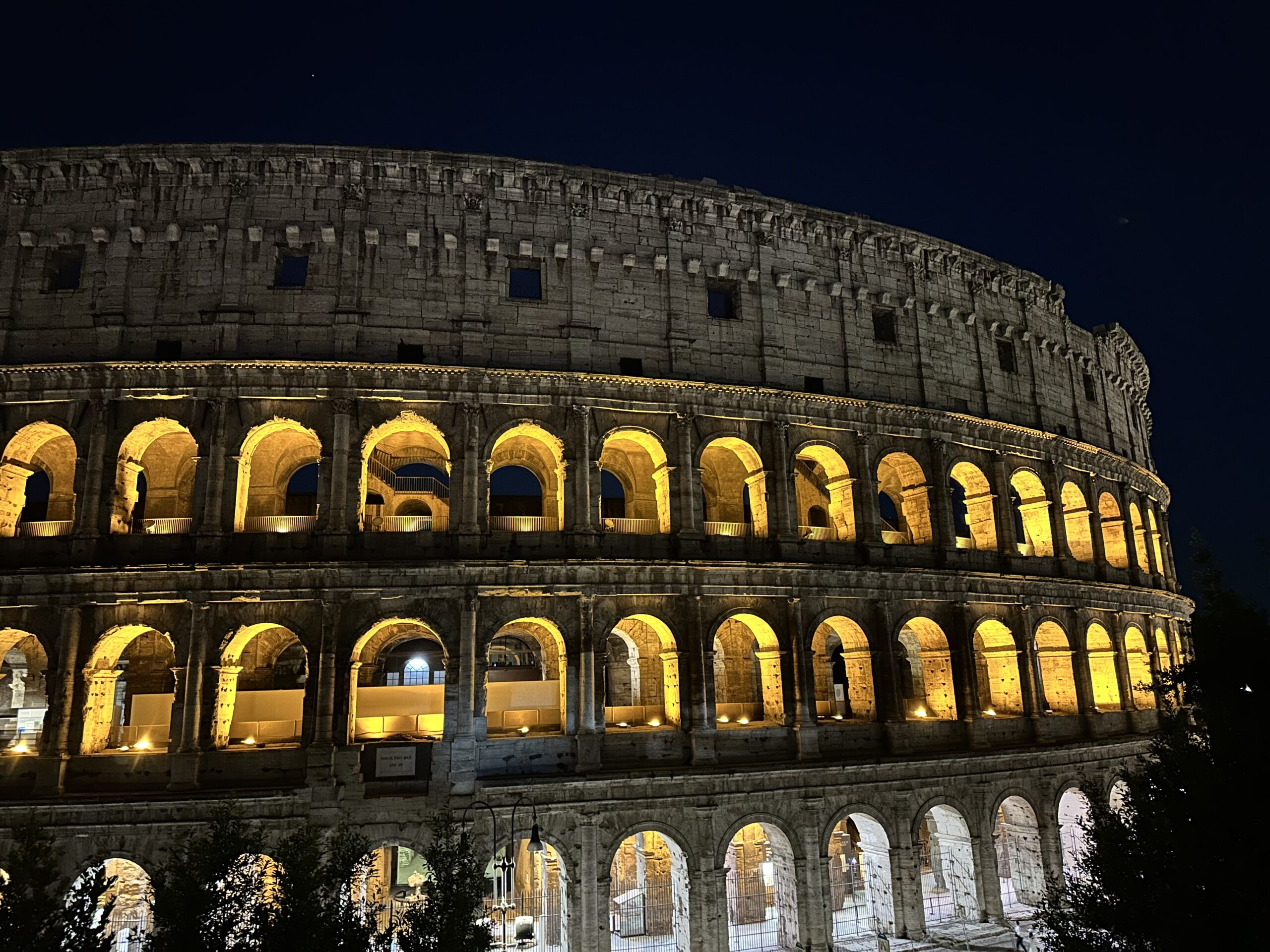 a photo showing the Roman Coloseum at night