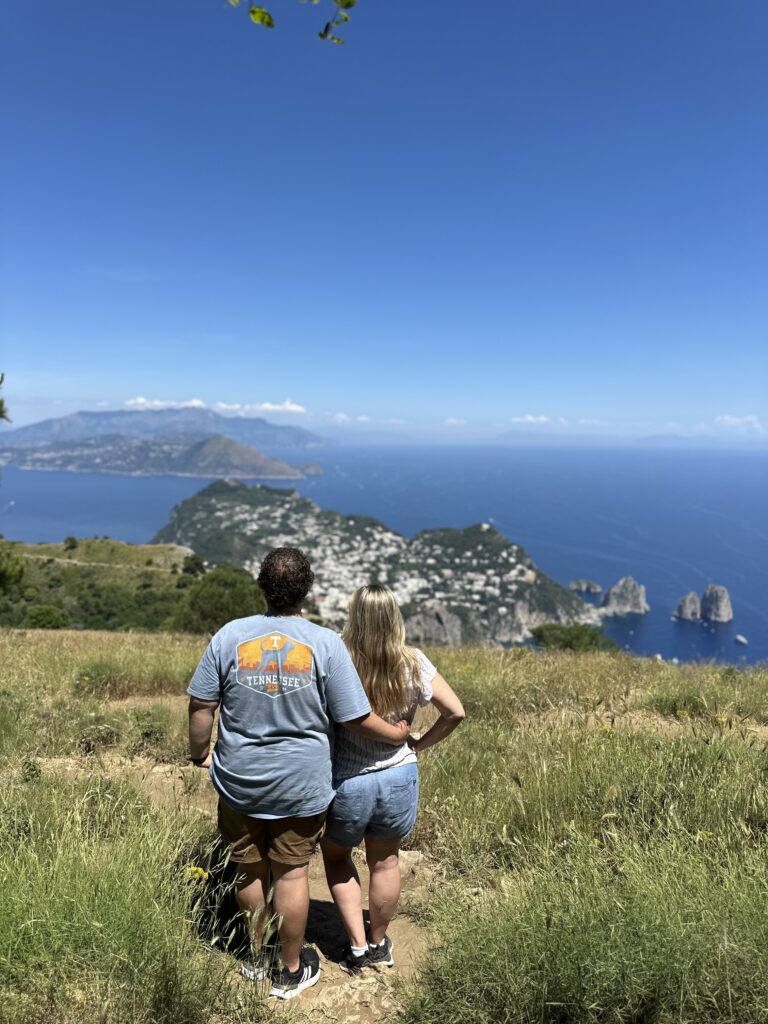 a couple embracing while looking out to the sea