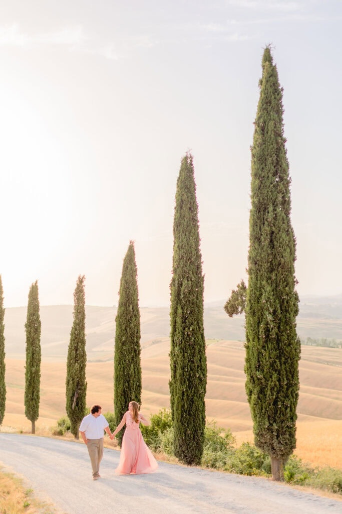 a couple surrounded by Cyprus trees