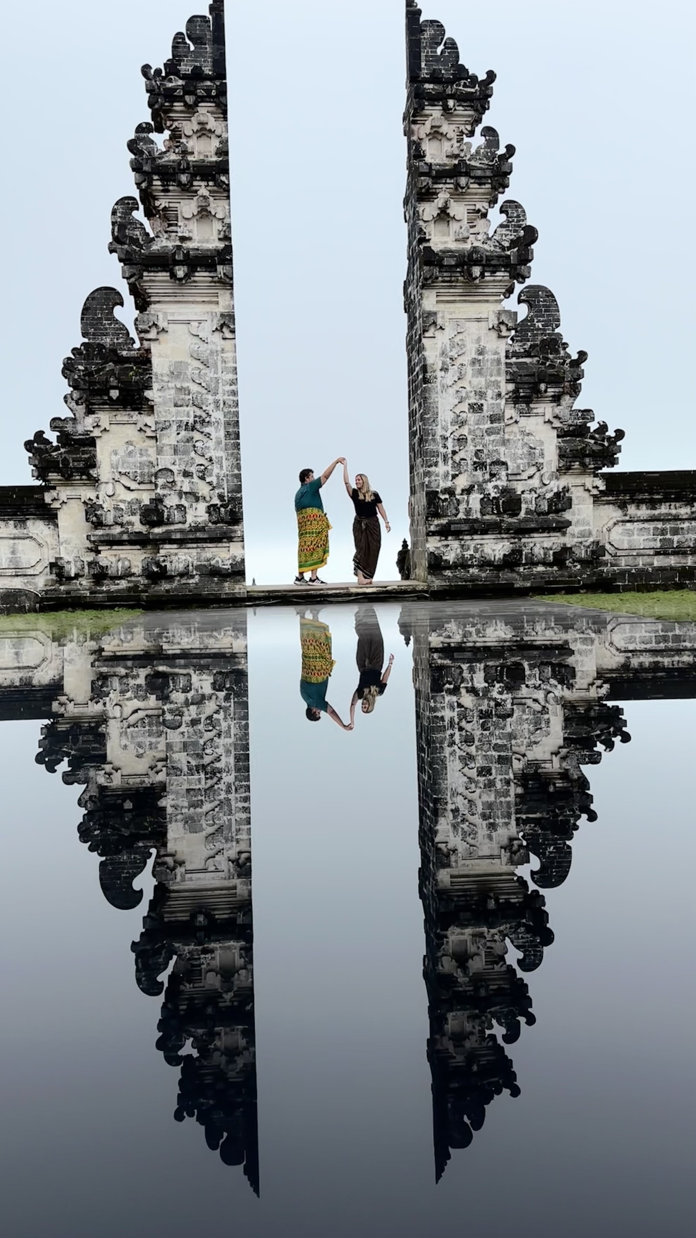 a couple twirling at a temple