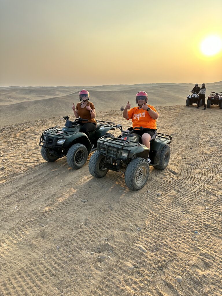 couple on ATV by Giza pyramids 